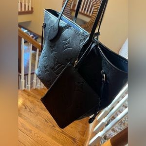 Louis Vuitton - Black , chic and practically new .